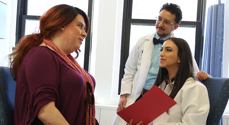 Two doctors with a transgender patient