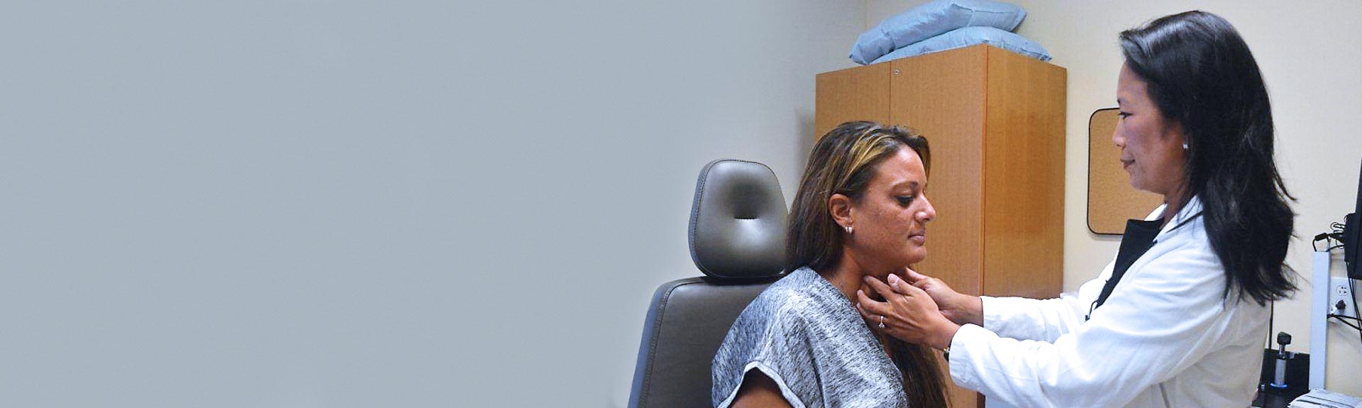 Image of doctor examining patient
