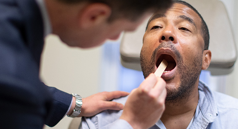 Image of doctor examining patient