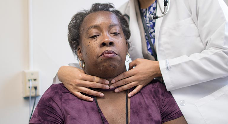 Image of doctor examining patient