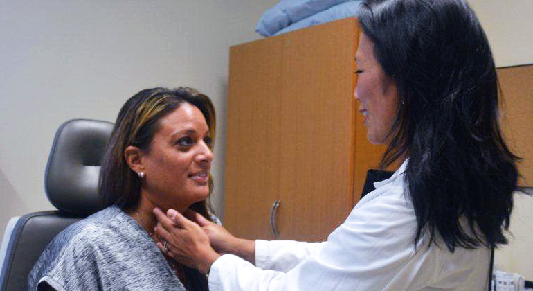 Image of doctor examining patient