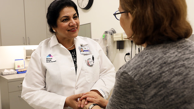Dr. Chadha speaking with patient