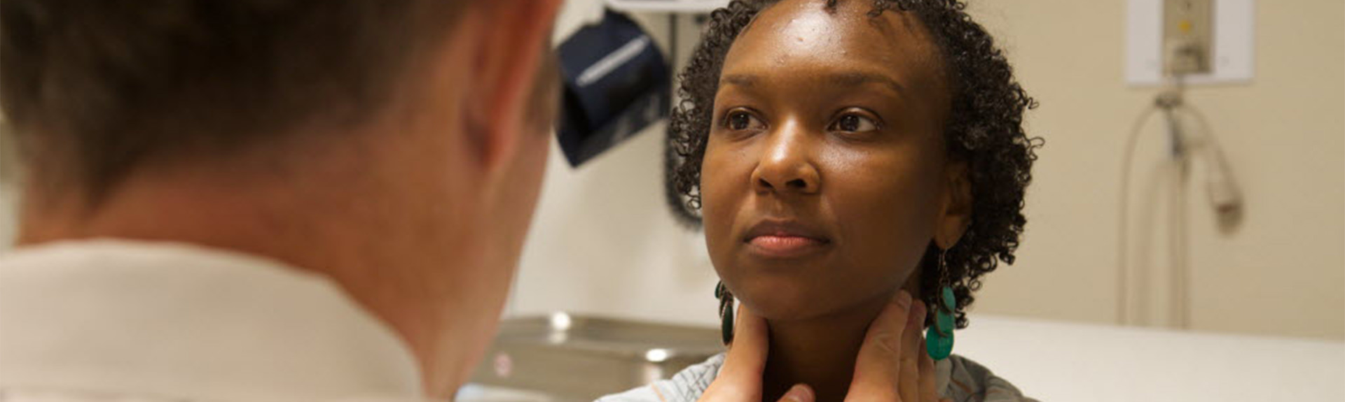 Photo of patient getting examed by doctor