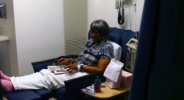 image of patient reading in recliner