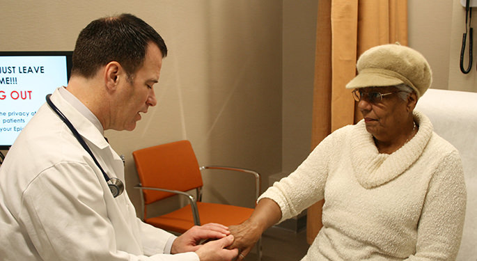 Male doctor with female patient