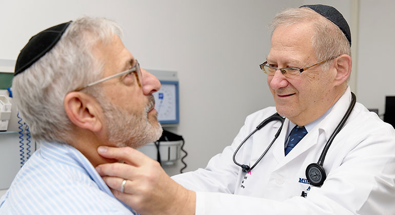 doctor examining patient