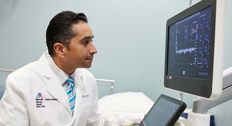 Image of doctor looking at computer screen