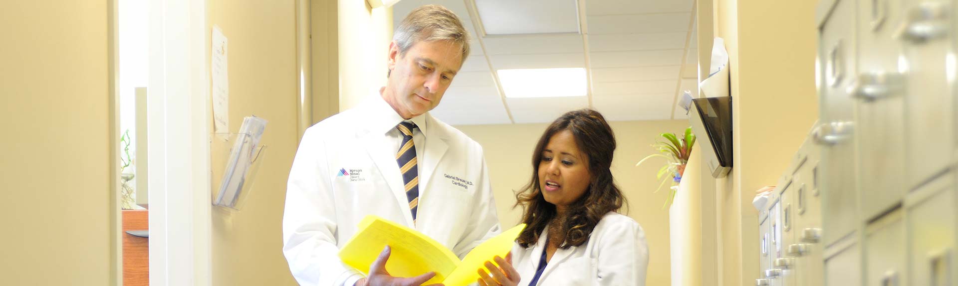 Doctors conferring in a hallway