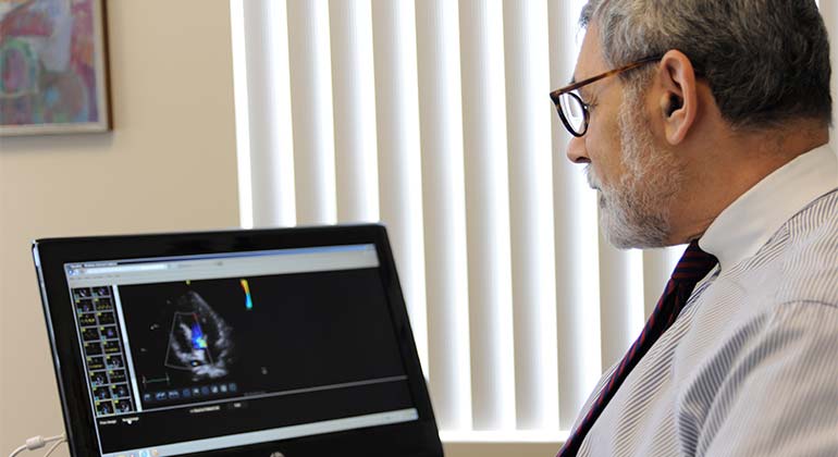 Doctor analyzing results on screen