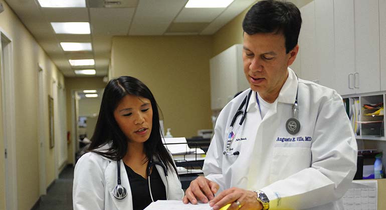 Two doctors analyzing results