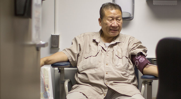 patient with blood pressure cuff