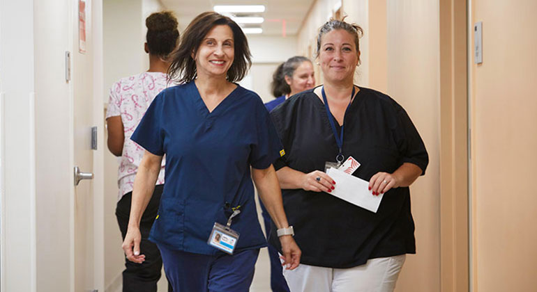 medical professionals walking in a hallway