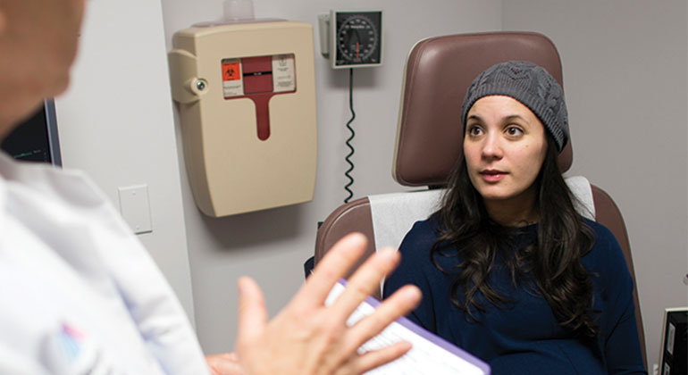 doctor talks with patient