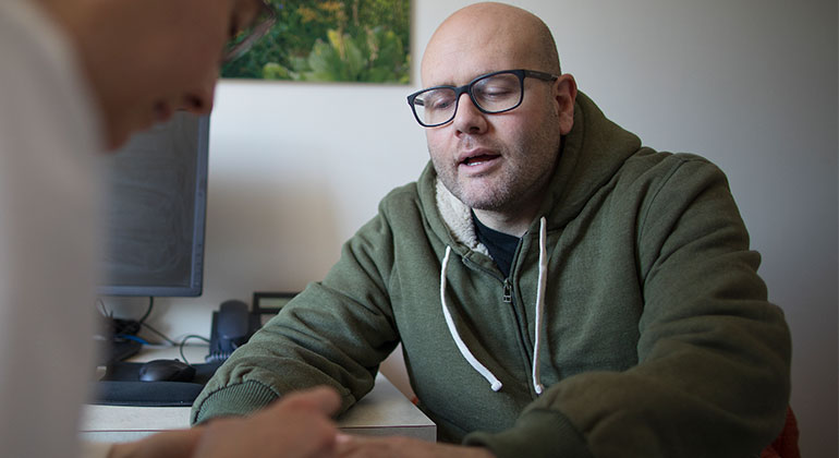 doctor talks with patient