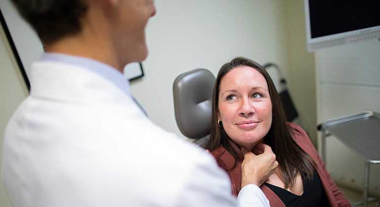 doctor checking patient