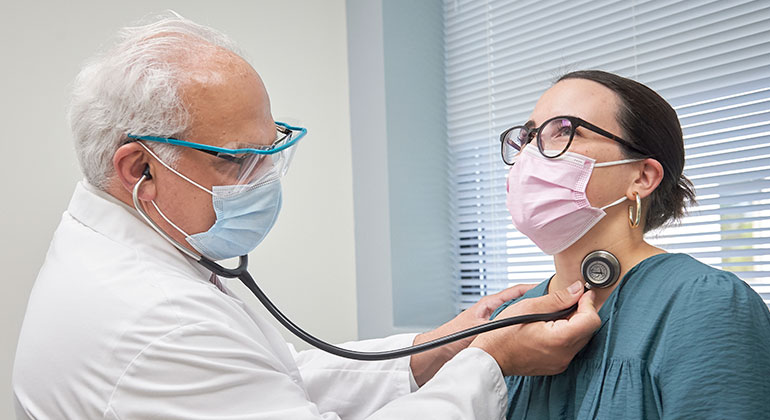 doctor checking patient