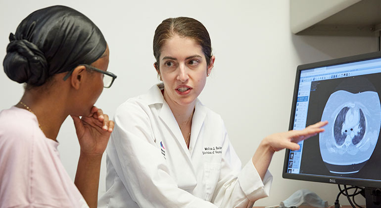 doctor going over scan with patient