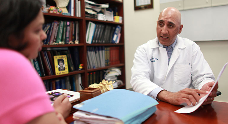 Image of doctor talking to patient
