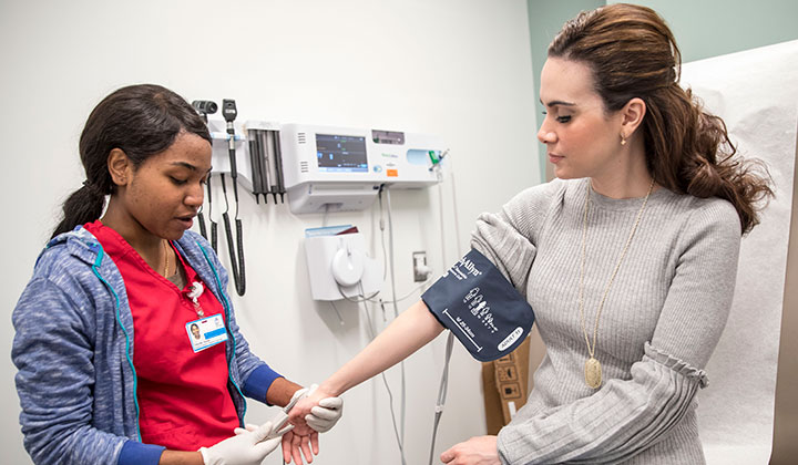 nurse taking patient