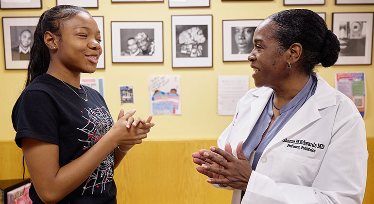 doctor talking to teenager