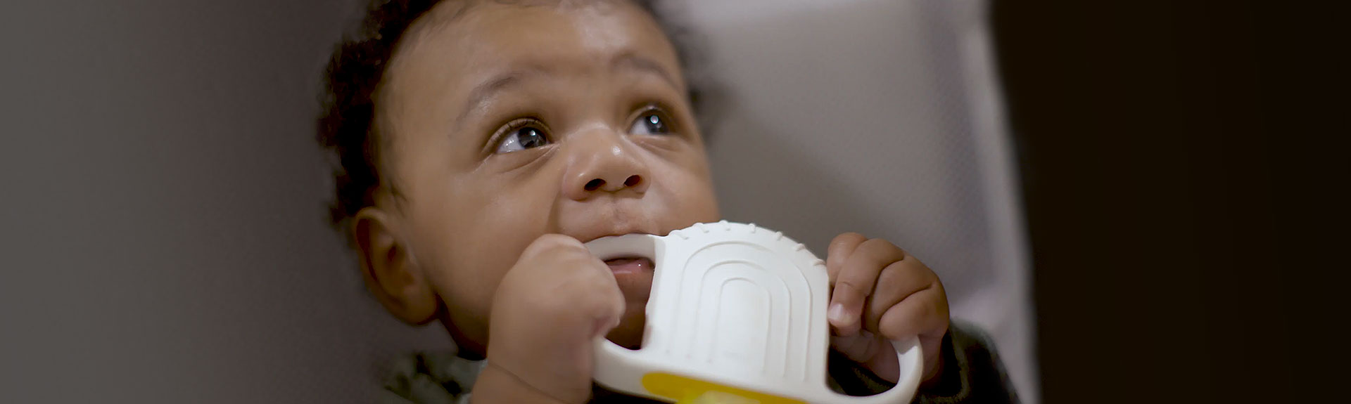 Infant patient with a teether toy