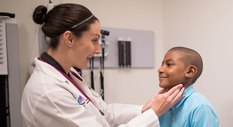 Image of doctor with child patient