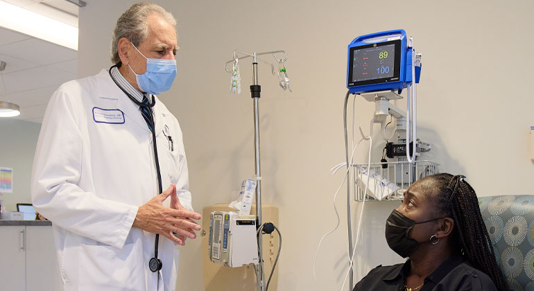 doctor talking with patient in examine room