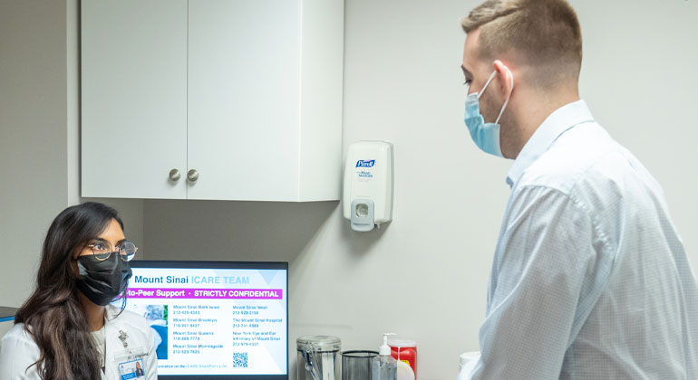 doctor talking to patient examine room