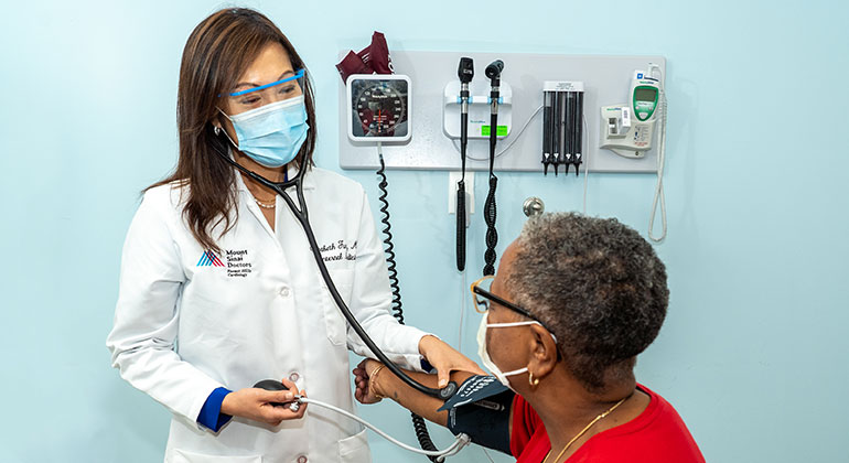 patient having blood pressure taken