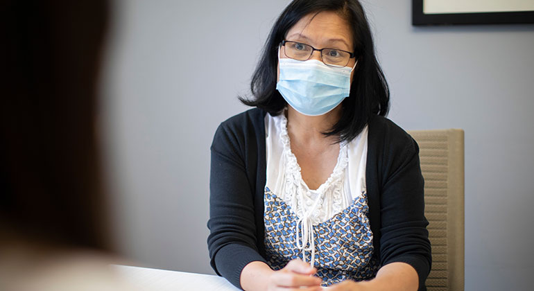 Patient sitting at table