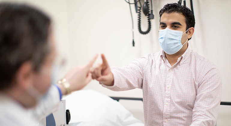 Male patient in exam room