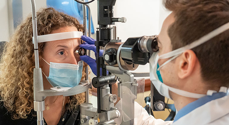 Patient having eyes examined 