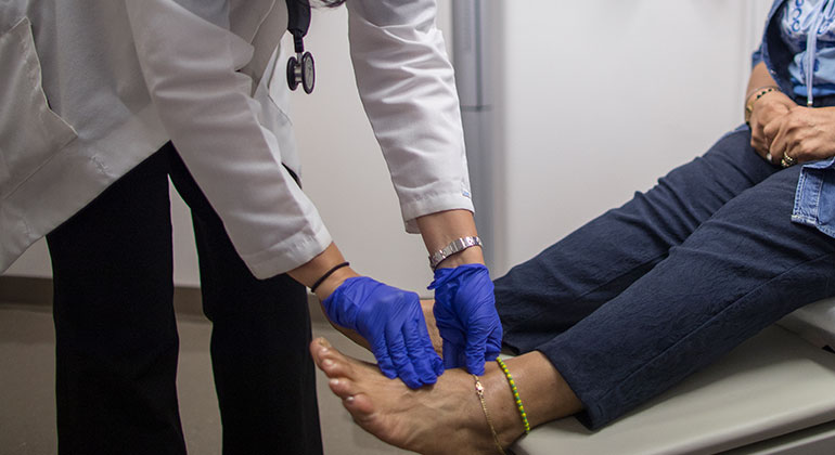 Patient having foot examined