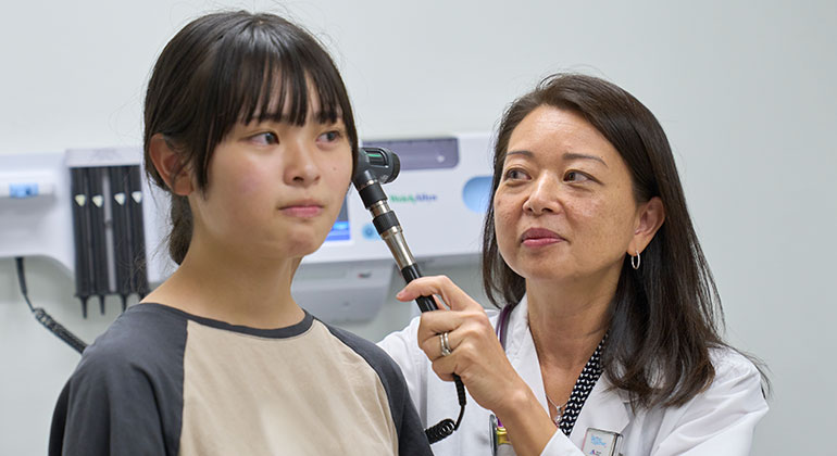 doctor examining patient