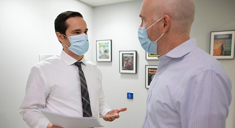 medical professional talking with patient