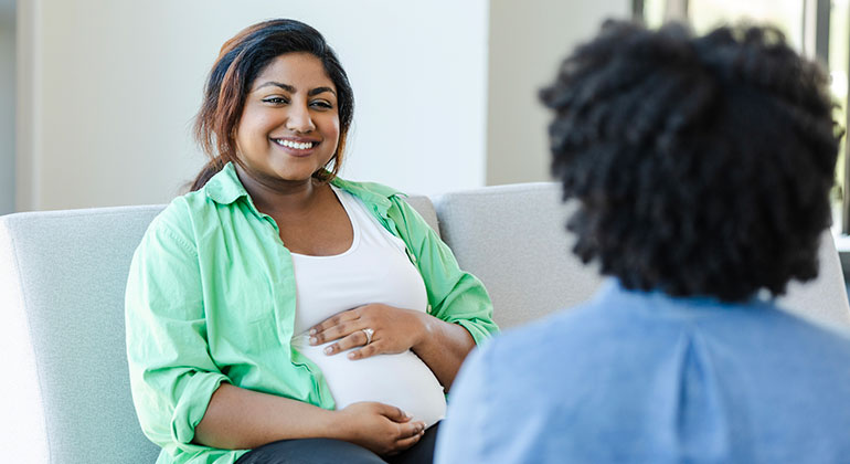 pregnant woman in conversation