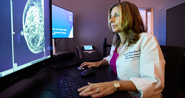 image of doctor viewing mammogram