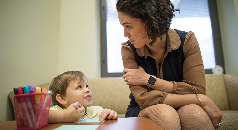 medical professional talks with patient