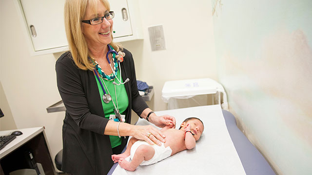 Doctor examining baby 
