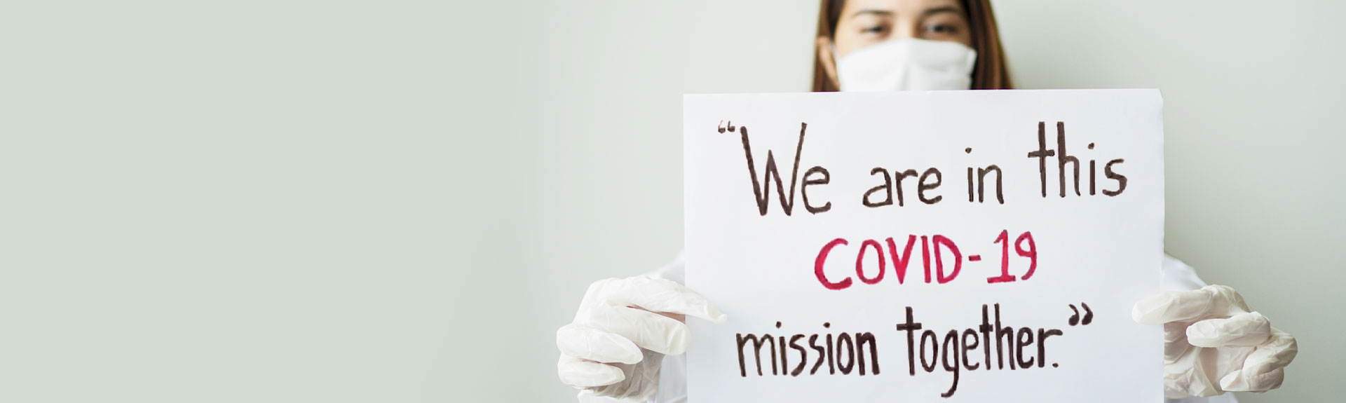 Image of Nurse holding sign 