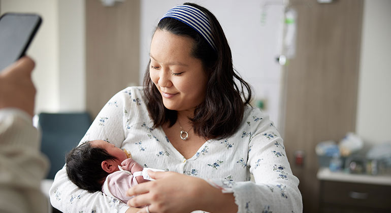 mother holding baby
