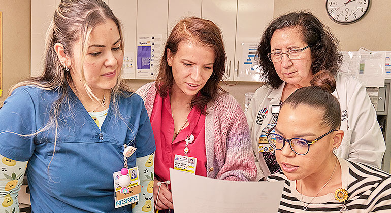 staff reviewing paperwork