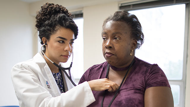 Female doctor with patient