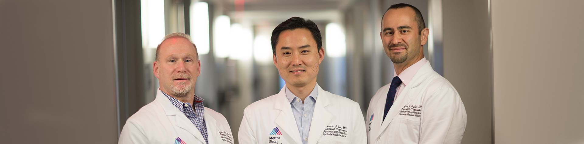 Three Mount Sinai doctors standing in hallway