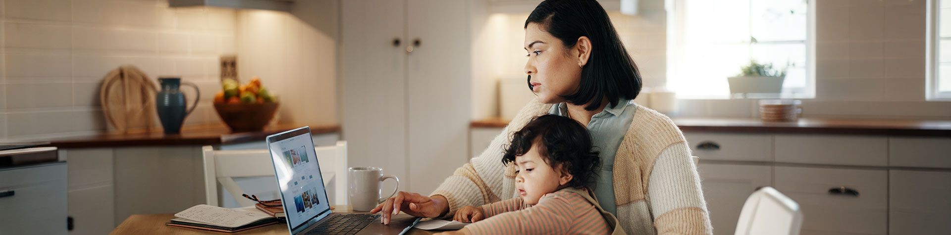 Woman with child on a computer