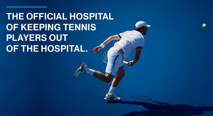 Image of male tennis player after hitting ball. Text reads "The official hospital of keeping tennis players out of the hospital." The US Open logo is in the lower left corner.