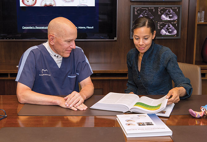 A photo of David H. Adams, MD, and Joanna Chikwe, MD