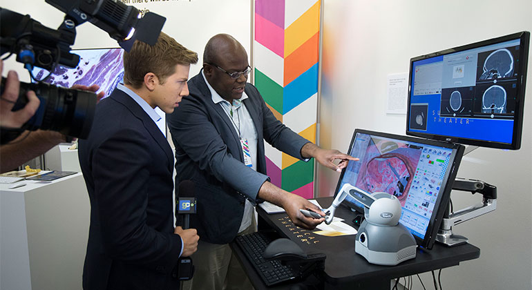 Errol Gordon, MD demonstrates how the brain surgery simulator works