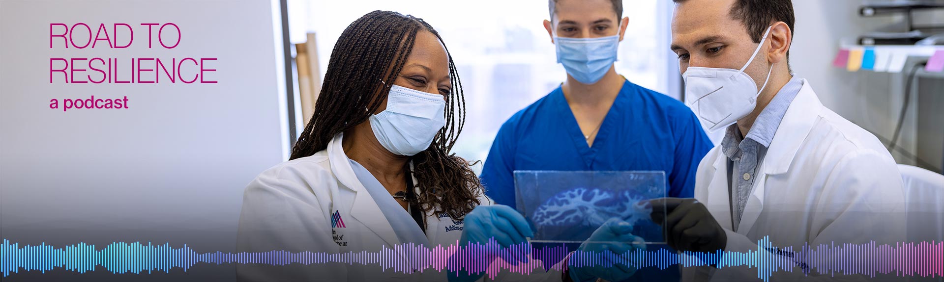 group of doctors analyzing a brain scan