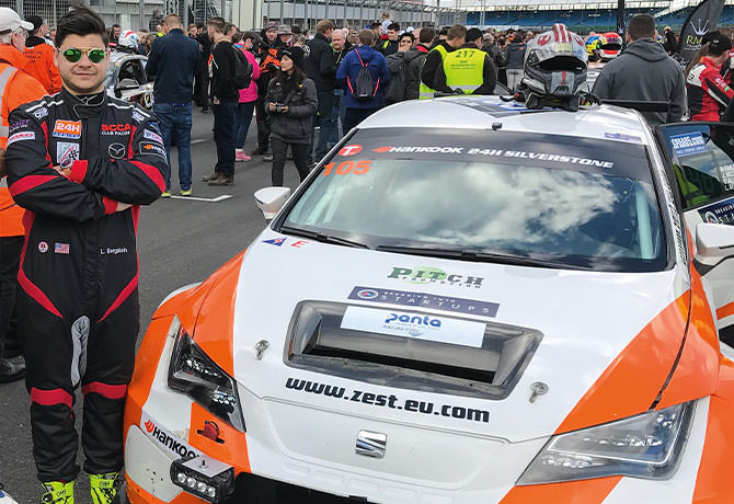 A photo of Lance Bergstein standing beside a race car. He has type 1 diabetes, collaborated closely on a treatment plan with his physician, Carol J. Levy, MD, Director of the Mount Sinai Diabetes Center.